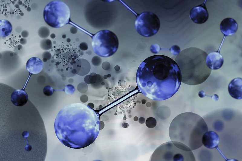 Abstract image of interconnected atoms representing the complex process of 45Q and 45V tax credit consulting.