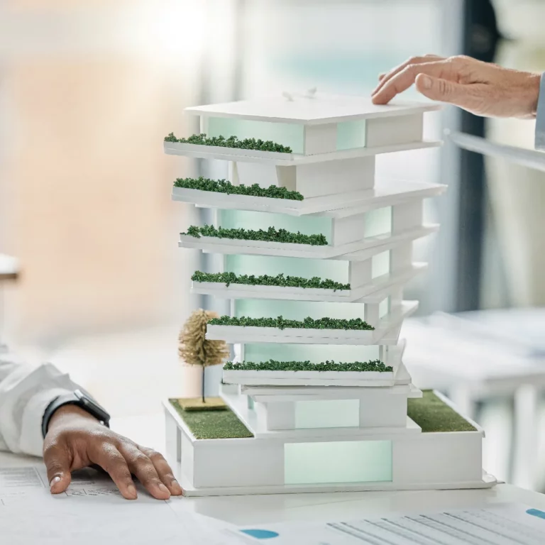 Science-based targets consulting illustrated by building model eco friendly diversity and hands of architect